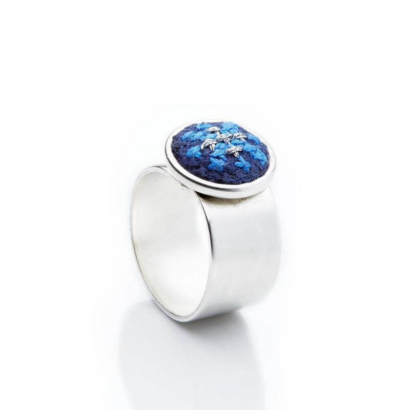 An image of the GLOW_RING_SILVER_BLUE_ARAB_0a2bc2a4-f8d2-4bbd-8fc2-e7429d579472.jpg by Earth Heir