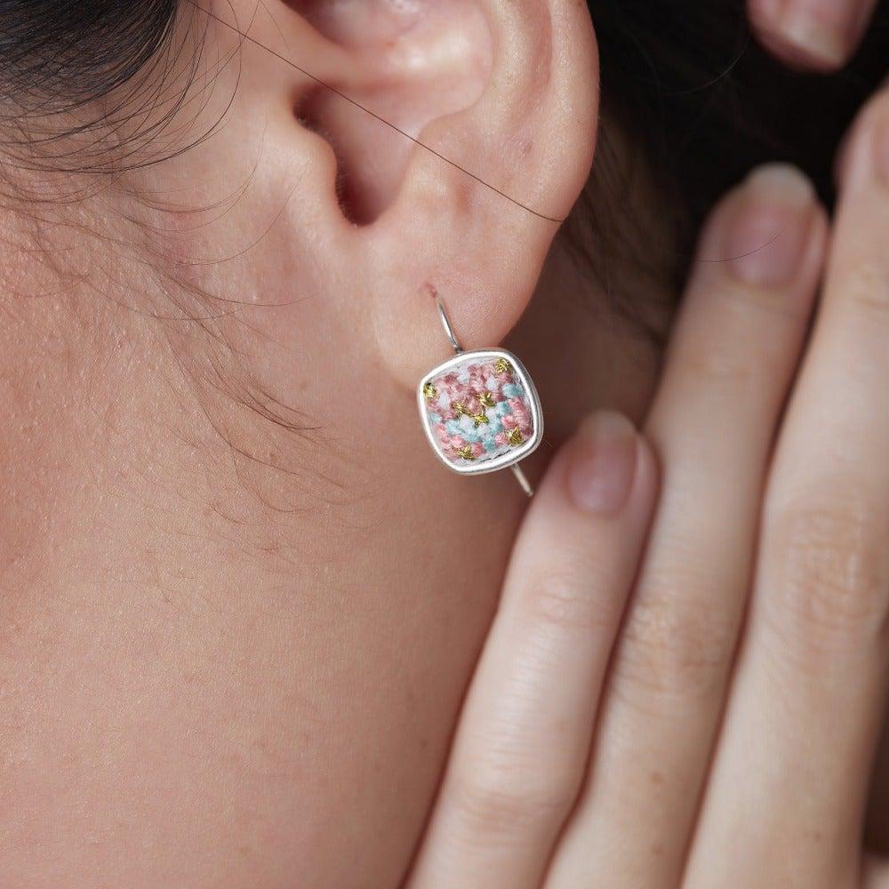 An image of ethical jewelry earring, showcasing Malaysian heritage in sustainable fashion, supporting a social enterprise.