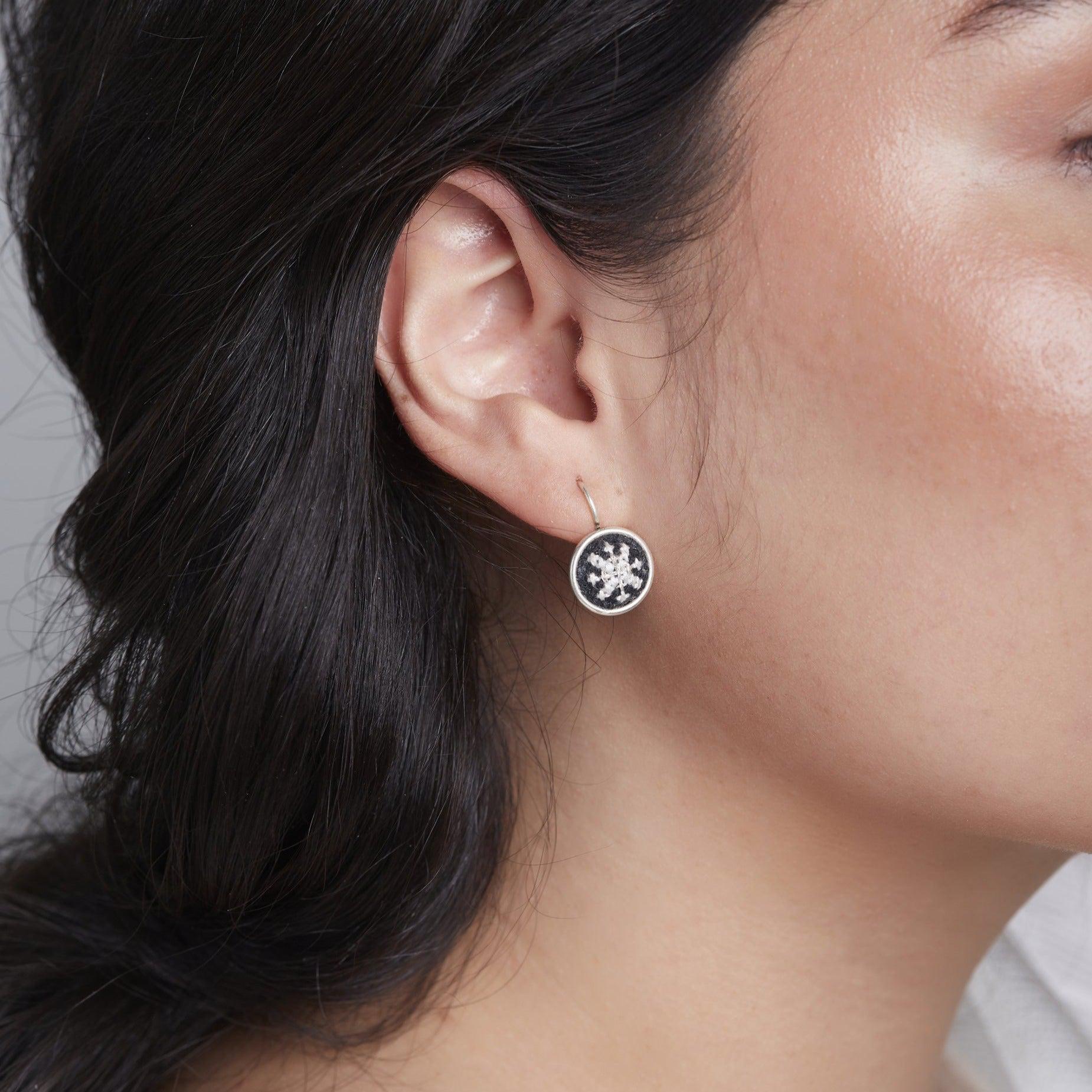 An image of ethical jewelry earrings, showcasing Malaysian heritage and handcrafted artisanal crafts, promoting sustainable fashion.