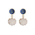 An image of the EarthHeir_ArabesqueBlue_SeashellEarrings_001.jpg by Earth Heir